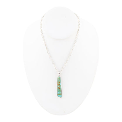 Turquoise pendant necklace on a white background