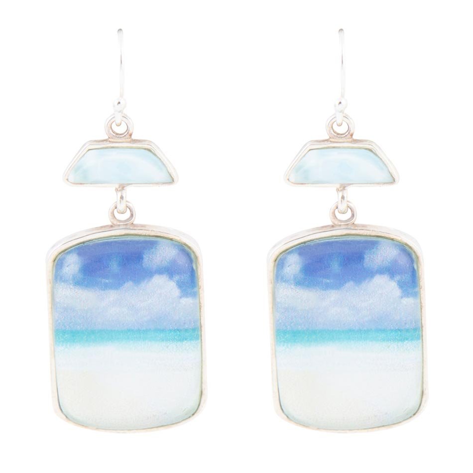 Earrings with sky and cloud design on a white background