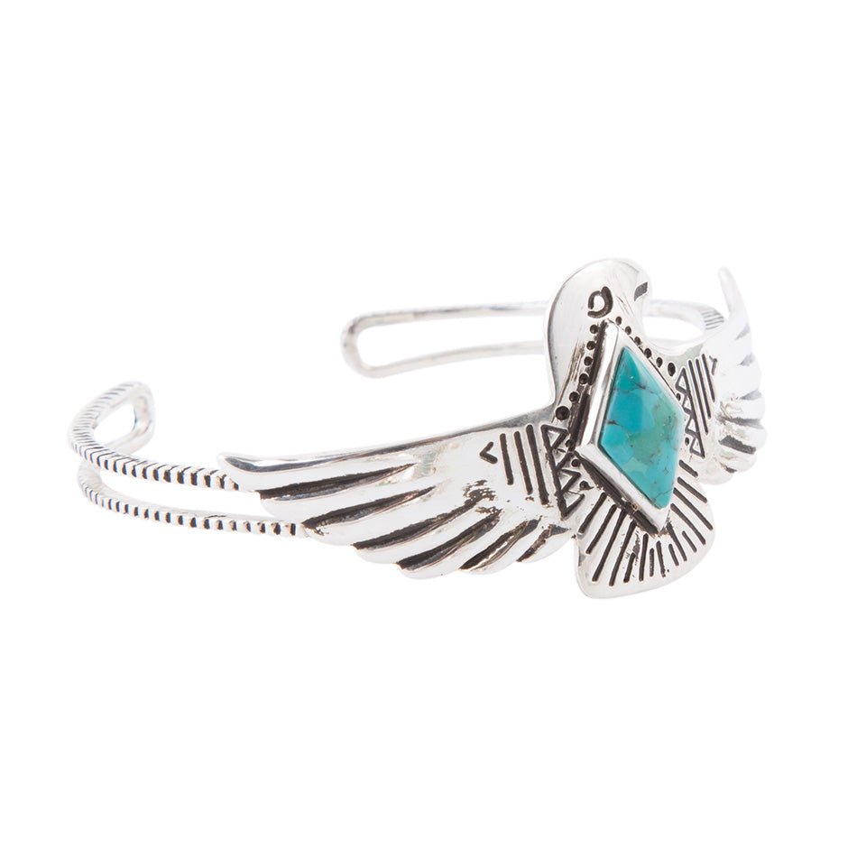 Silver bracelet with a turquoise stone on a white background